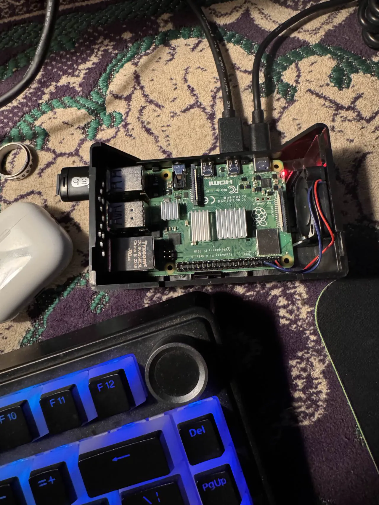 Raspberry Pi in its case, cabled up next to a keyboard